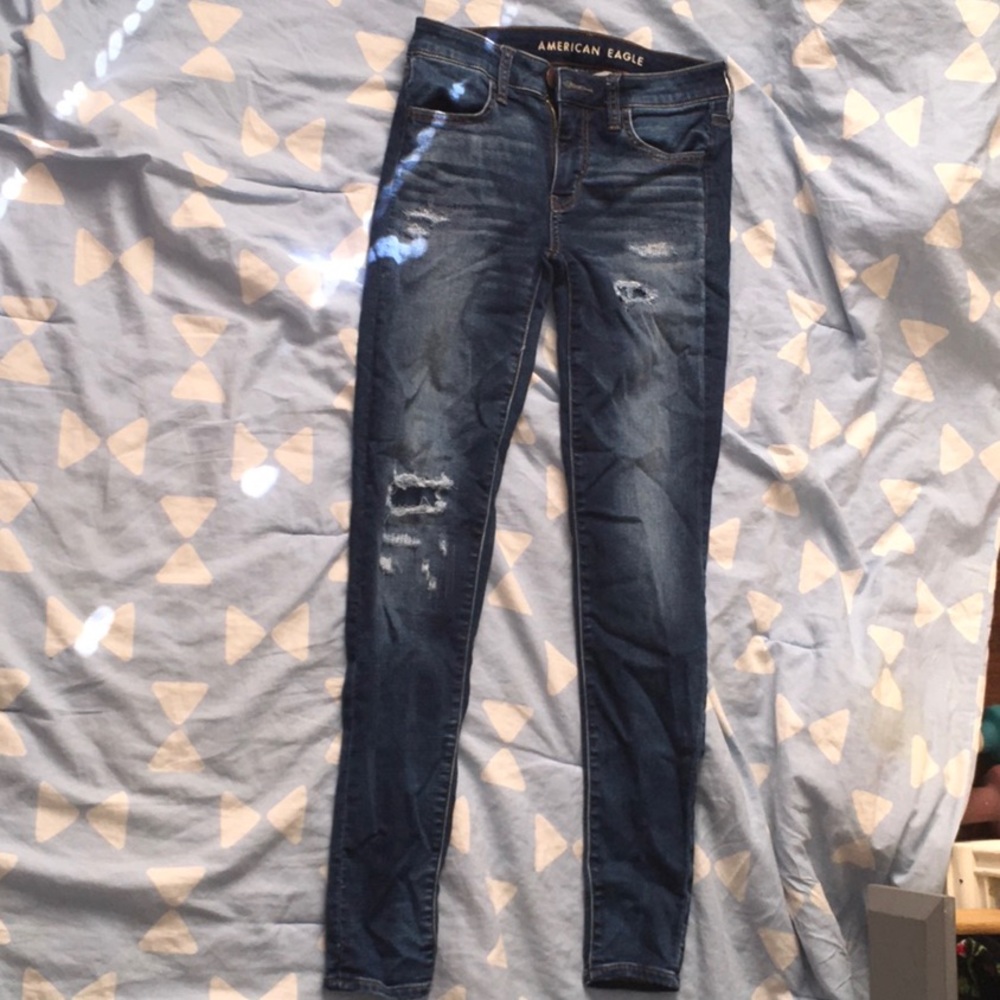 Ripped dark blue jeans